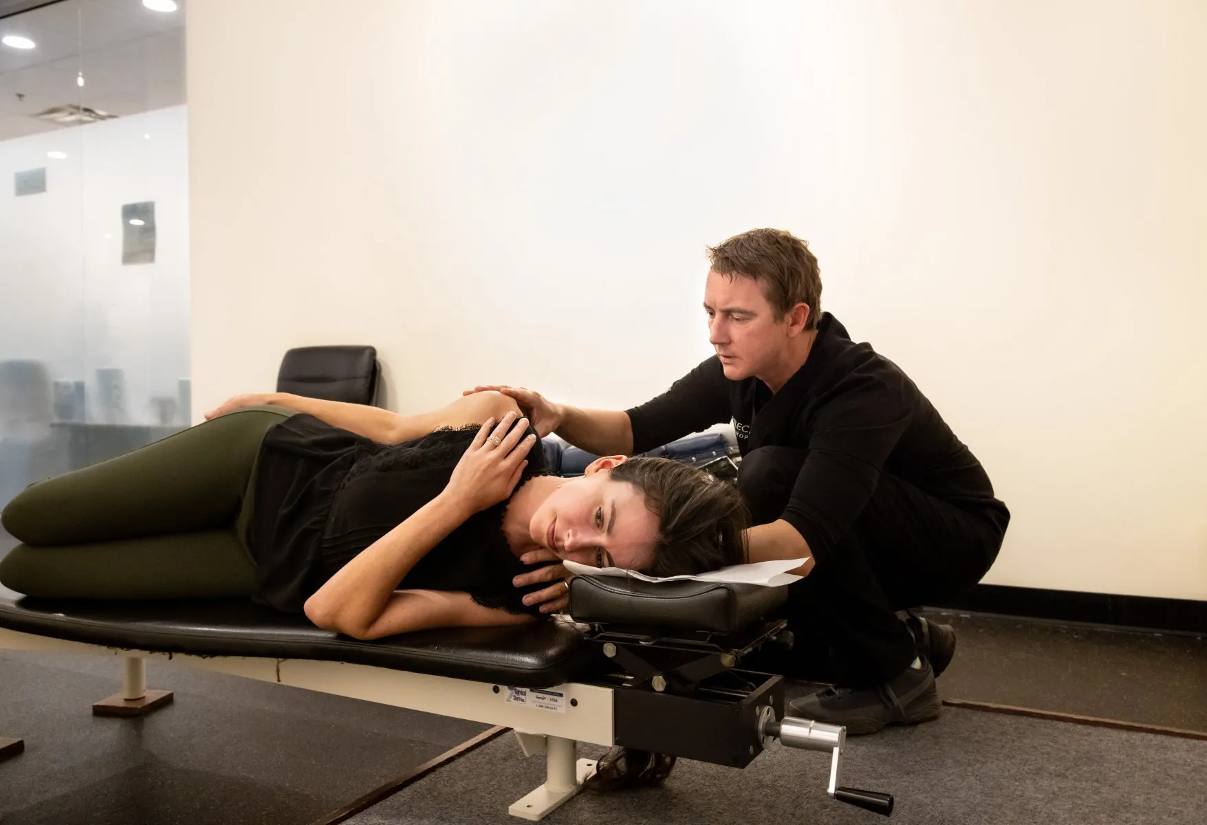 Dr. McCanse performing gentle NUCCA spinal correction without twisting or cracking at a Vermont chiropractic clinic.