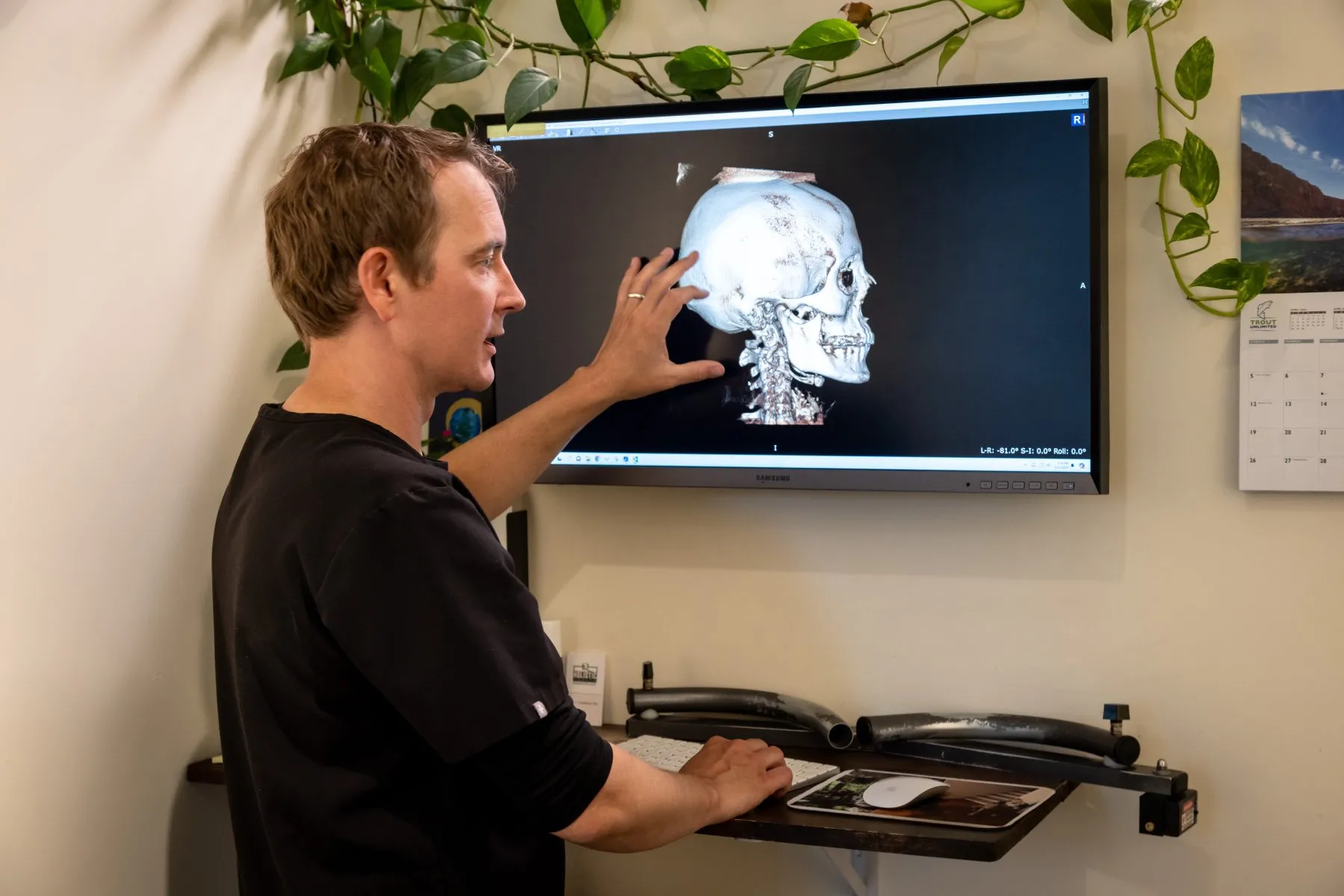 Dr. McCanse explaining 3D cone beam CT scan of the cervical spine as part of NUCCA chiropractic structural correction in Vermont