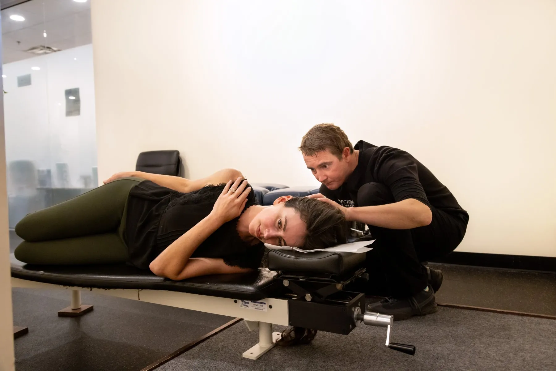 NUCCA-style upper cervical adjustment using a gentle, low-force technique to correct atlas misalignment at Precision Chiropractic.